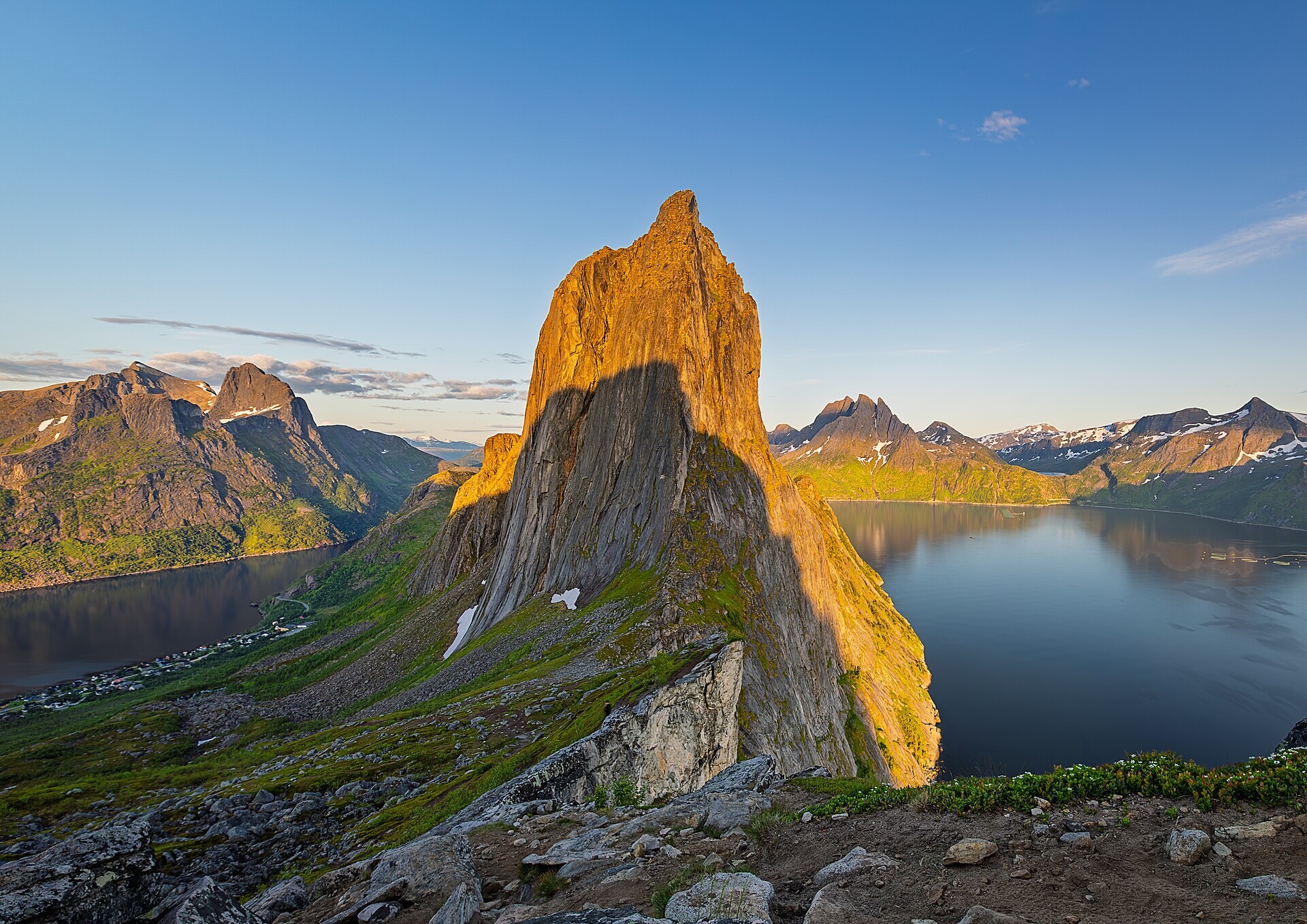 The Segla fin glowing in the midnight sun above the fjord